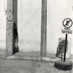 Untitled (person behind column)